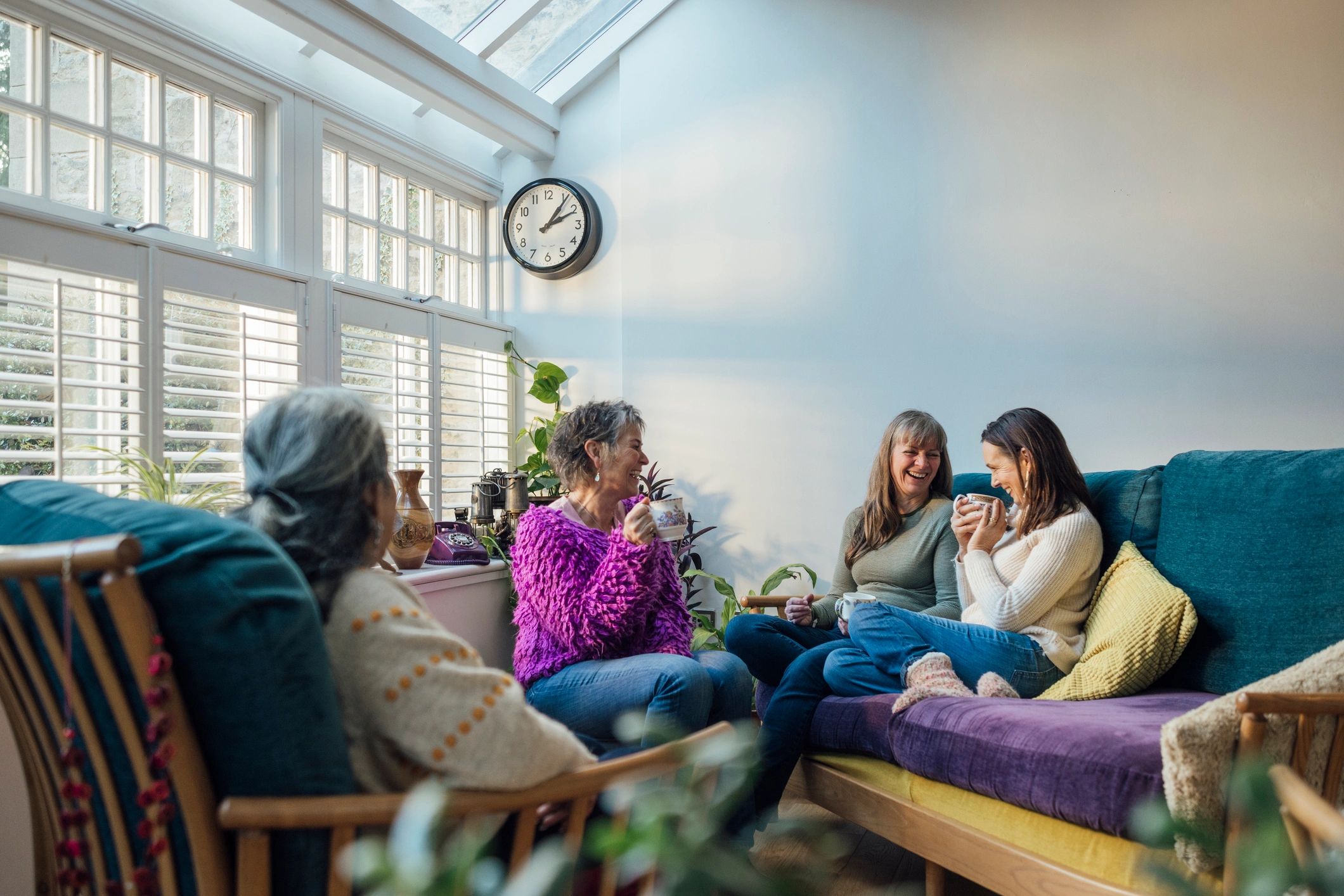 People gathered in a living room enjoying time together