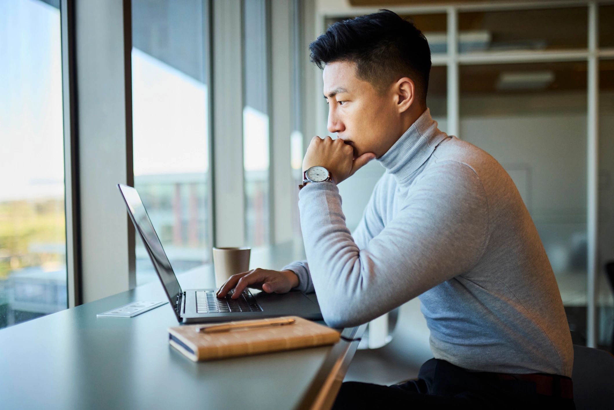 Small business professional working on a laptop in an office